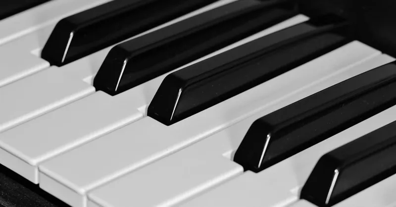 High-resolution close-up of piano keys showcasing the elegant black and white contrast.
